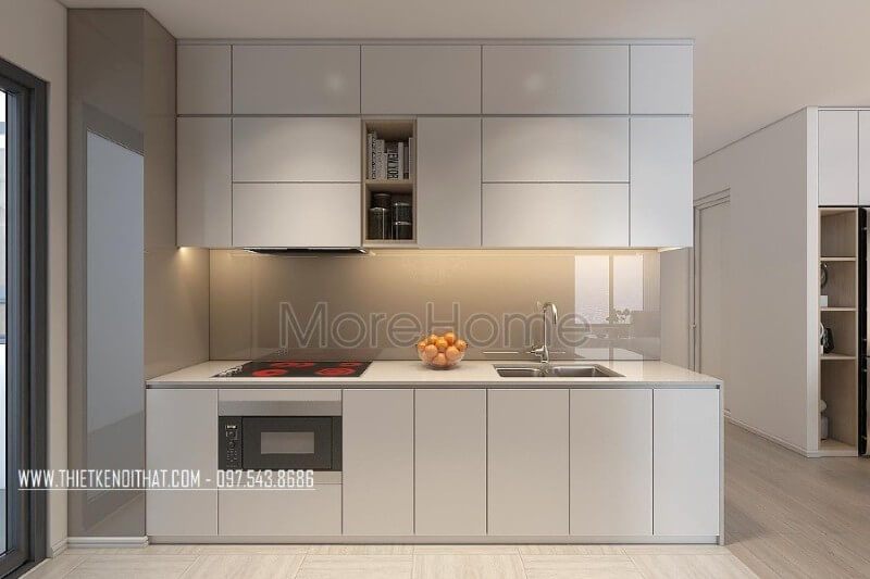 Mẫu tủ bếp kiểu dáng chữ i gỗ công nghiệp màu trắng kết hợp phân chia các ngăn tủ một cách hợp lí, tạo cho người nội trợ thuận tiện hơn trong quá trình mang lại những bữa cơm ngon miệng cho những người thân yêu của mình