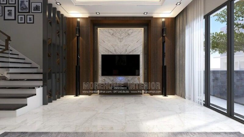 Phòng khách được trang trí bằng đá trắng và ốp tường đen, cùng với sự đối sánh giữa hai dàn loa dọc theo đường chiếu sáng từ một mảng tường gỗ đẹp mắt.