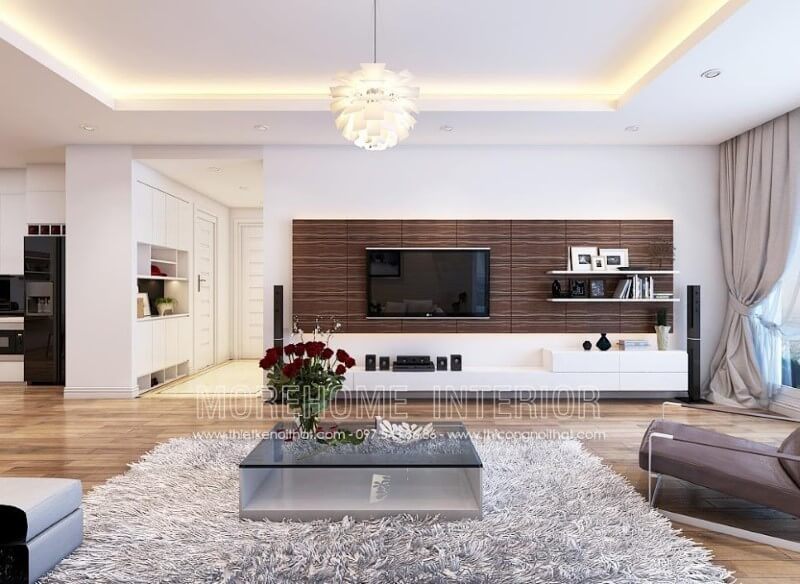 Lối thiết kế hiện đại của mặt bàn kính góp phần tạo nên vẻ đẹp năng động cho phòng khách.